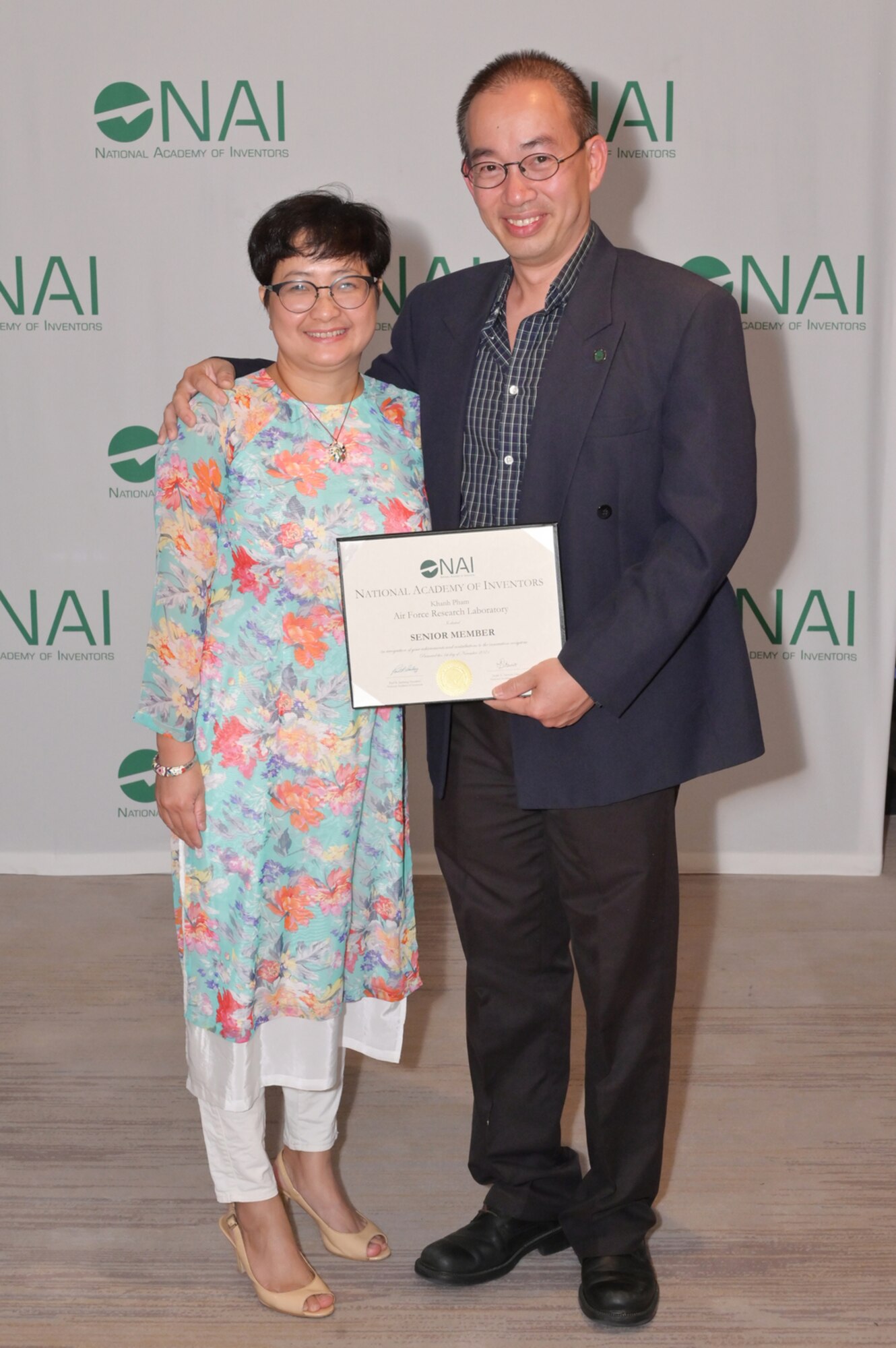 Air Force Research Laboratory principal aerospace engineer Dr. Khanh Pham with his wife Huong Nguyen at the National Academy of Inventors induction to the rank of NAI Senior Member in a ceremony held earlier this year in Tampa, Florida. (Photo/courtesy of NAI)