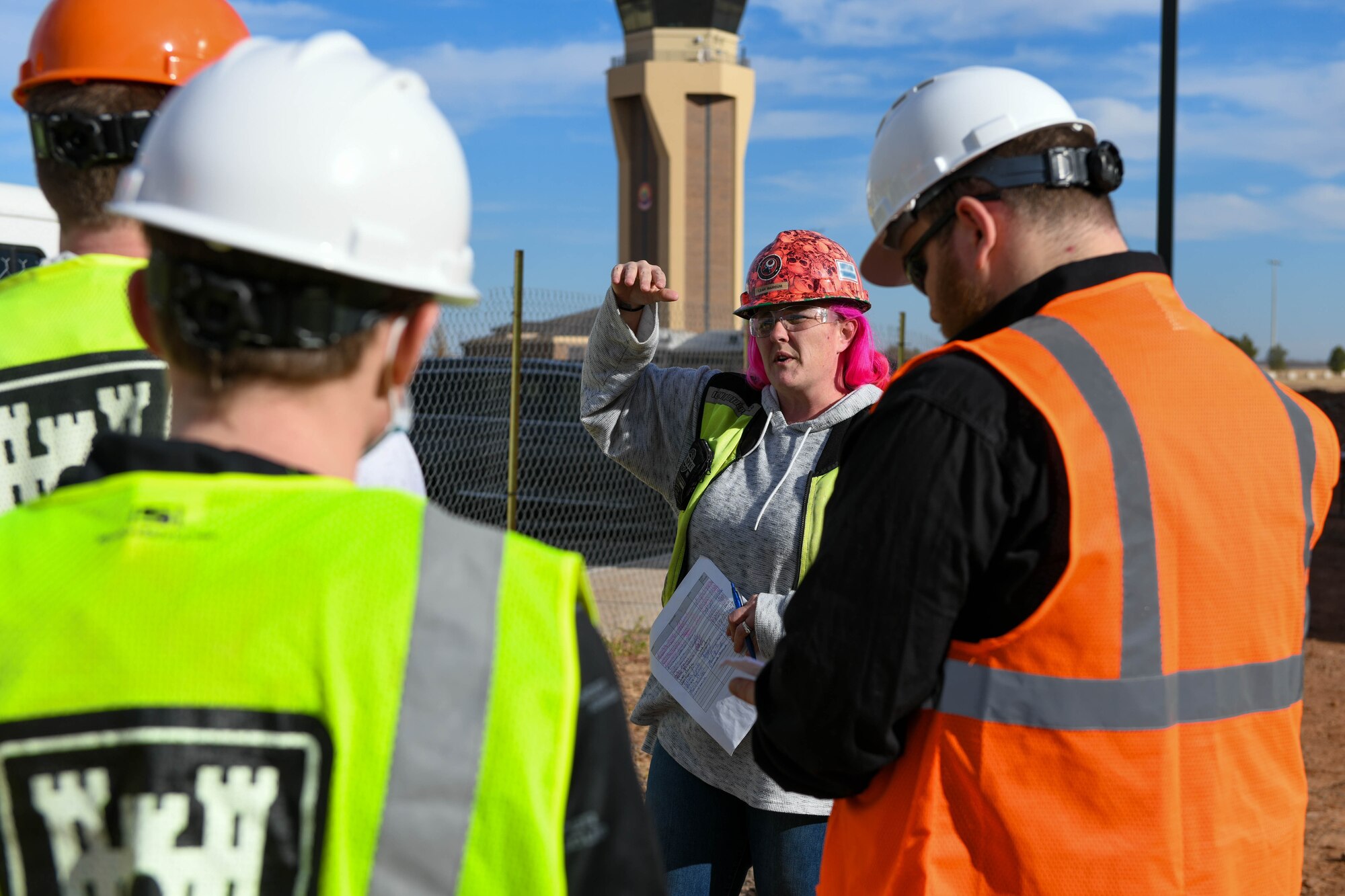 Leah Marcum, SGS Contracting Services site safety and health officer, briefs Cameron University students on an Altus Air Force Base (AAFB), Oklahoma construction site, Dec. 3, 2021. Students from Cameron University visited AAFB for a tour of a construction site and the 97th Civil Engineer Squadron buildings. (U.S. Air Force photo by Airman 1st Class Trenton Jancze)
