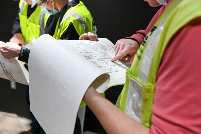 Students from Cameron University observe a hangar under construction on Altus Air Force Base (AAFB), Oklahoma, Dec. 3, 2021. The students were able to see first hand what different disciplines of engineers do around AAFB, including operations, installation management, fire and emergency services and emergency management. (U.S. Air Force photo by Airman 1st Class Trenton Jancze)