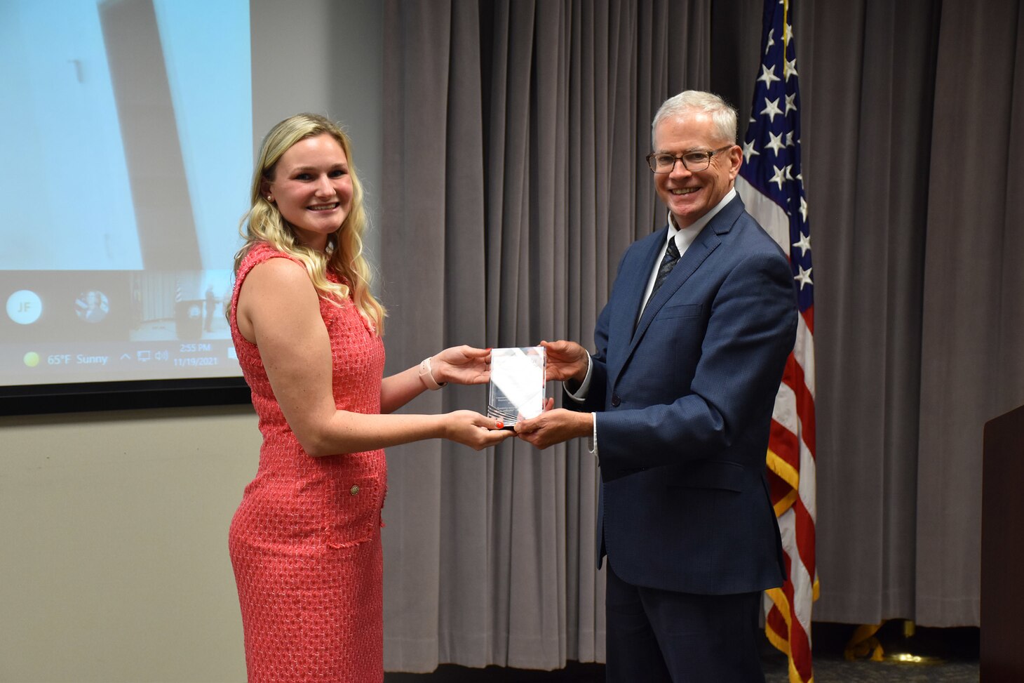 Dr. William Burnett, Technical Director, Naval Meteorology and Oceanography Command (CNMOC), presents Ms. Sydne Workman, Naval Oceanographic Office and CELP graduate, with a graduation award at the FY2020 CNMOC Executive Leadership Program graduation ceremony at Stennis Space Center, MS, Nov. 19, 2021. The Naval Meteorology and Oceanography Command directs and oversees more than 2,500 globally-distributed military and civilian personnel who collect, process and exploit environmental information to assist Fleet and Joint Commanders in all warfare areas to make better decisions faster than the adversary.