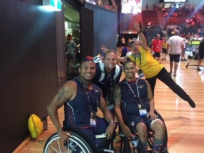 Coach Adriane Wilson takes a time out with Army Sgt. Ryan Major and Staff Sgt. Joel Rodriguez of Team USA at the 2018 Invictus Games in Sydney Australia.