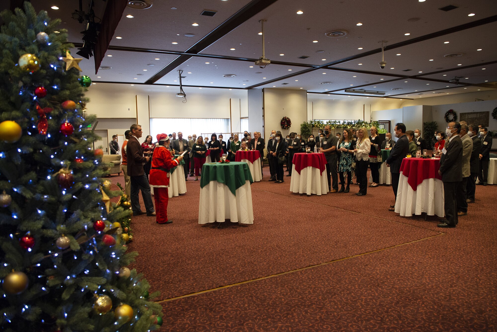 Col. Andrew Campbell, 374th Airlift Wing commander, kicks off the 374th AW Holiday Social at the Yokota Officers Club at Yokota Air Base, Japan, Dec. 11, 2021. The event was an opportunity for wing leadership to celebrate the holiday season together with Japanese partners. A range of attendees from the Japan Air Self Defense Forces, Japan America Air Force Goodwill Association, friendship clubs, and the Government of Japan attended the event. (U.S. Air Force photo by Tech. Sgt. Christopher Hubenthal)