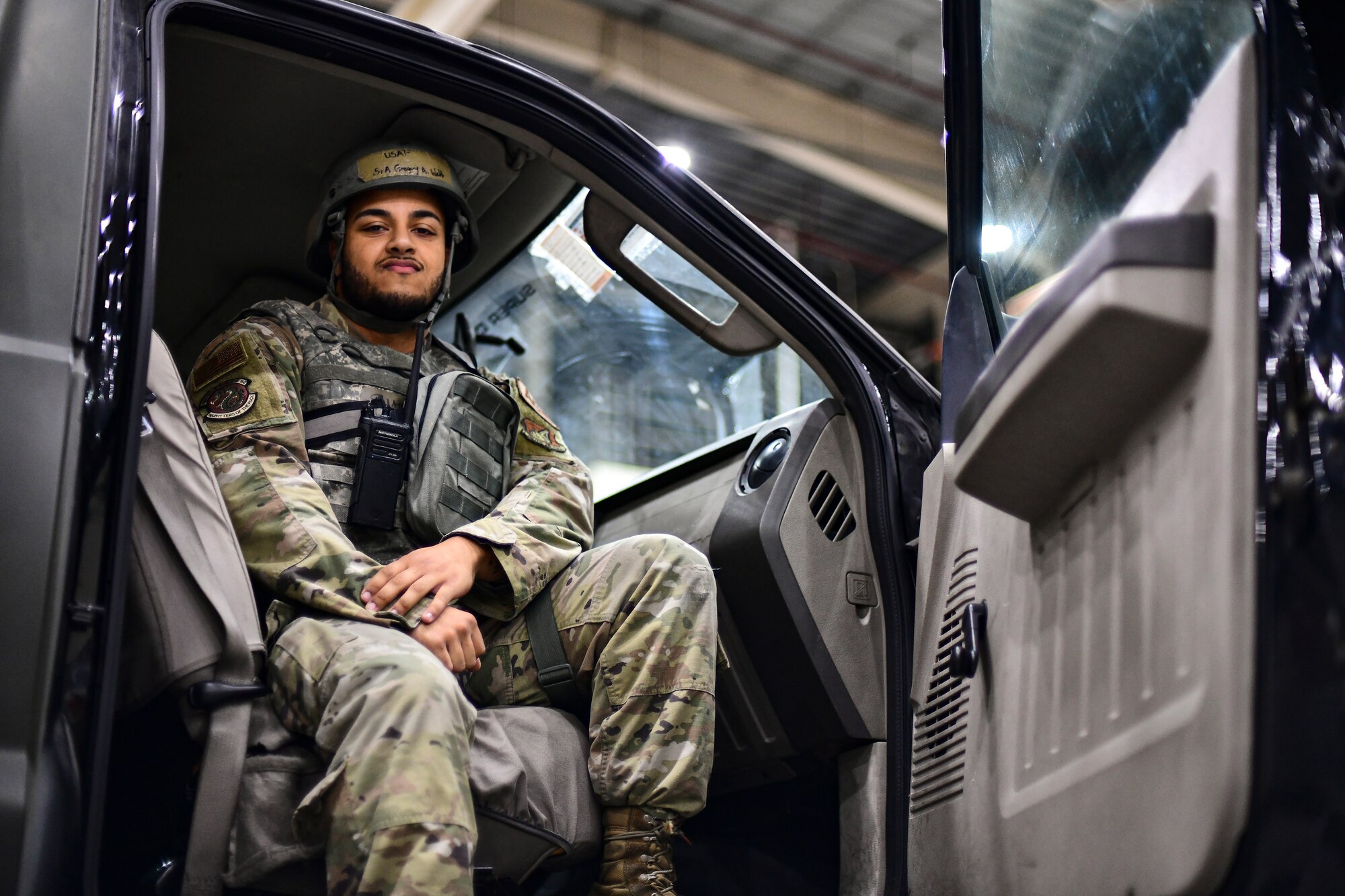 An Airman sits in a truck.