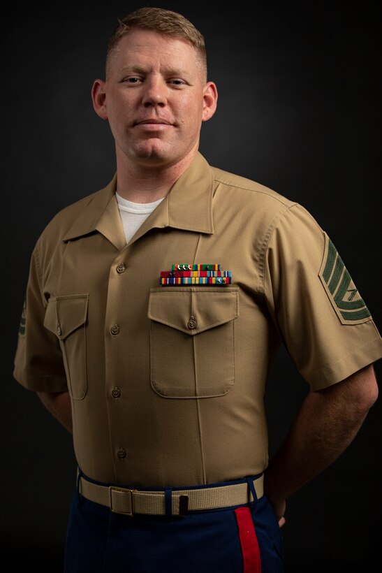U.S. Marine Corps Gunnery Sgt. Ethan Branch, a career planner with Headquarters and Support Battalion, Marine Corps Installation Pacific, poses for a photo on Camp Foster, Okinawa, Japan, Dec. 6, 2021. Branch was awarded the Commandant of the Marine Corps Career Planner of the Year award for 2021. Marines nominated for Career Planner of the Year have displayed a consistent high level of performance that significantly and positively impacted mission accomplishment, reflecting exceptional leadership, management and organization skills, devotion to duty, and initiative in support of maintaining a quality enlisted career force. (U.S. Marine Corps photo by Cpl. Karis Mattingly)
