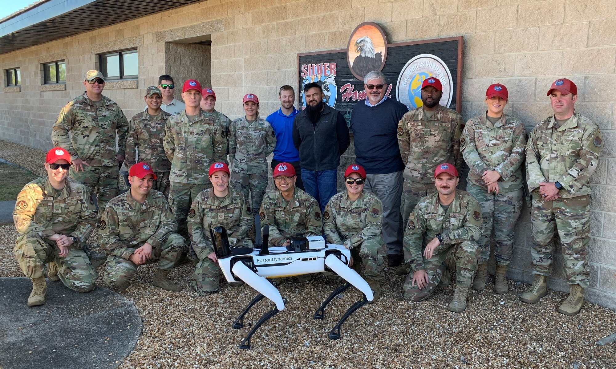 Group photo with an small unmanned ground vehicle.
