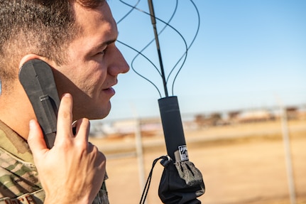 man listens to radio headset