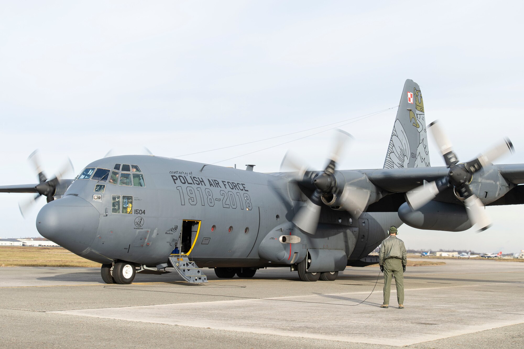 A Polish air force C-130E Hercules starts its engines following a foreign military sales mission Dec. 7, 2021, at Dover Air Force Base, Delaware. The United States and Poland have enjoyed decades-long warm bilateral relations. Poland is a stalwart NATO ally, and both the U.S. and Poland remain committed to the regional security and prosperity of Europe. Due to its strategic location, Dover AFB supports approximately $3.5 billion worth of foreign military sales annually. (U.S. Air Force photo by Roland Balik)