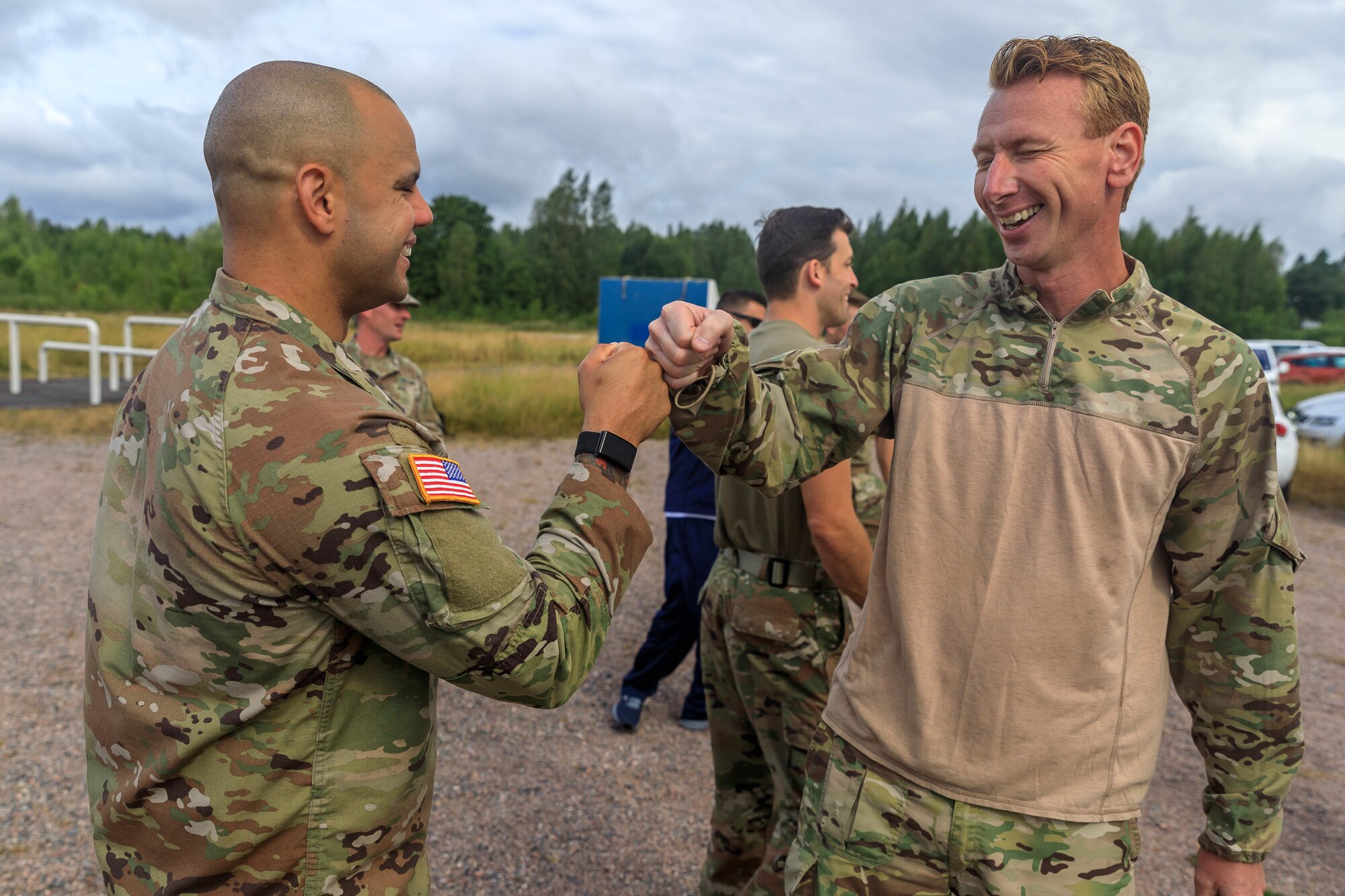 Staff Sgt. Devin Crawford, 108th Training Command, congratulates Rasmus Due, a competitor from the Danish reserve force, after completing of the land obstacle course during the Interallied Confederation of Reserve Officers military competition in Lahti, Finland on July 31st. The CIOR MILCOMP is an annual competition among NATO and Partnership for Peace nations. This competition test reserve service members from allied nations on several core disciplines in teams of three.
