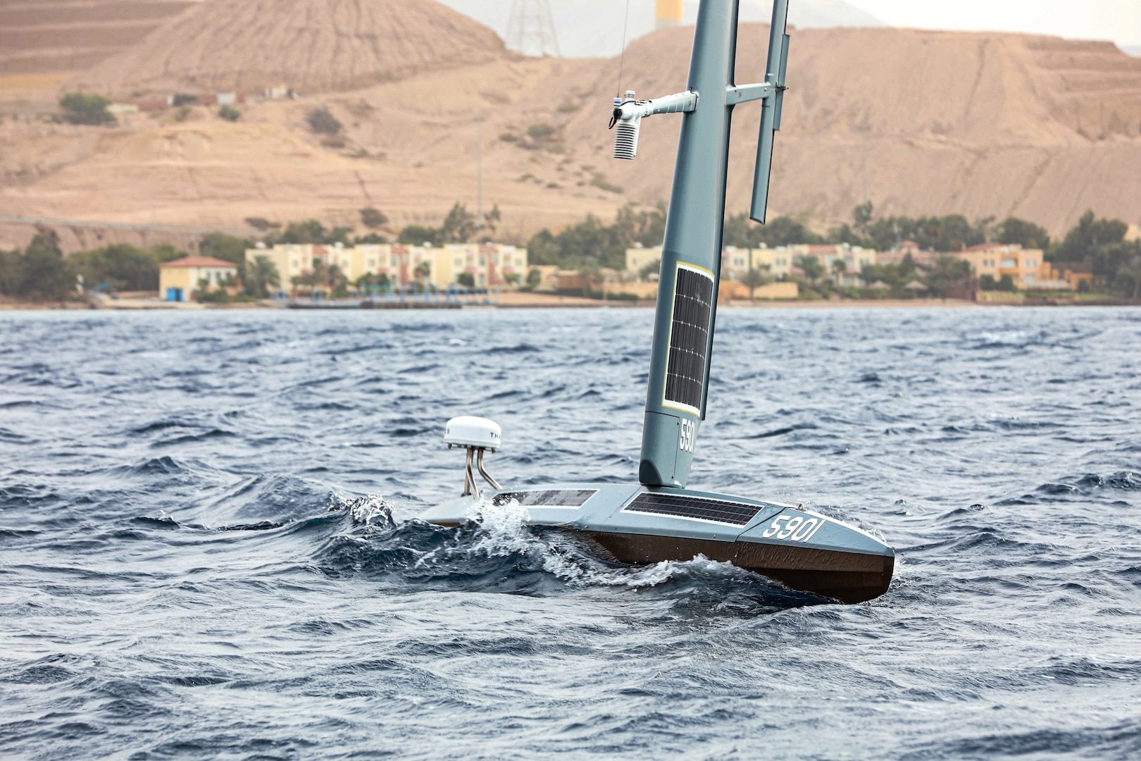 GULF OF AQABA (Dec. 12, 2021) A Saildrone Explorer unmanned surface vessel (USV) sails in the Gulf of Aqaba off of Jordan's coast, Dec. 12, during exercise Digital Horizon. U.S. Naval Forces Central Command began operationally testing the USV as part of an initiative to integrate new unmanned systems and artificial intelligence into U.S. 5th Fleet operations.
