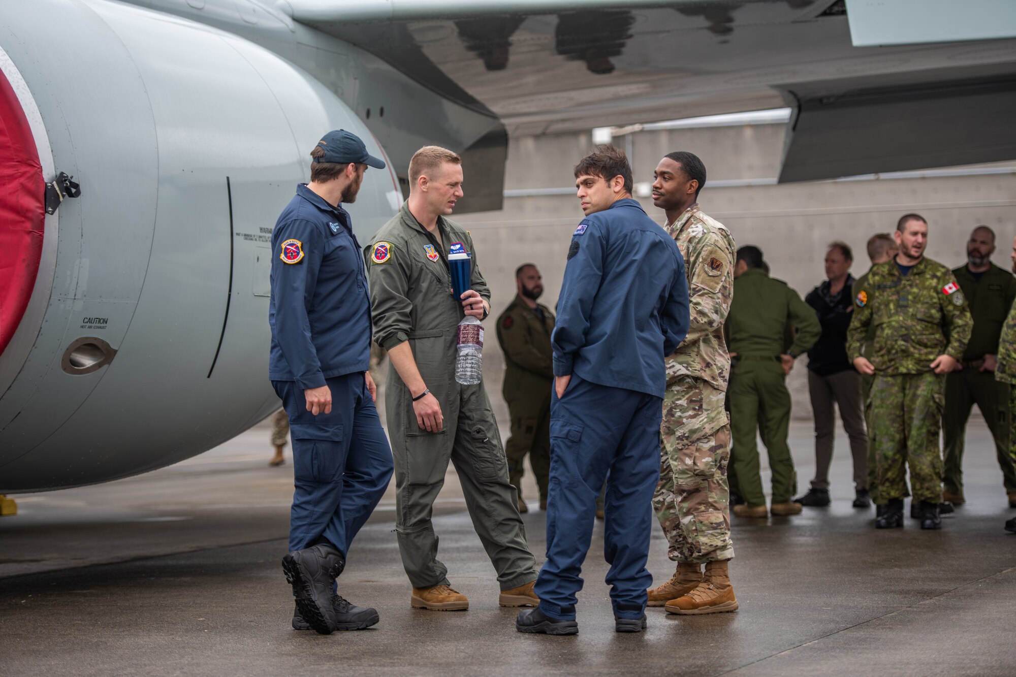 Two members from the U.S. Air Force talk with two military members from New Zealand