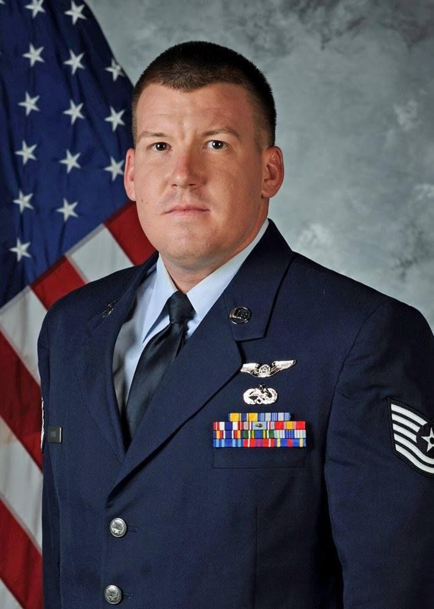 Man poses for official photo