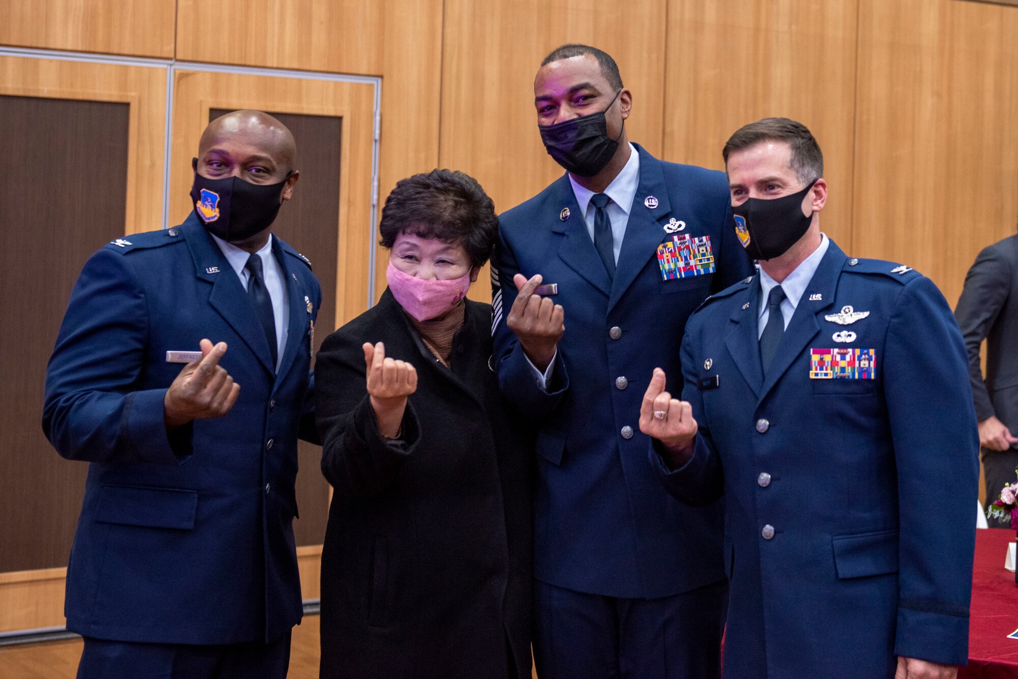 Col. Joshua Wood, 51st Fighter Wing commander, far right, Col. Henry Jeffress, 51st FW vice commander, far left, and Chief Master Sgt. Alvin Dyer, 7th Air Force command chief, right, pose for a photo