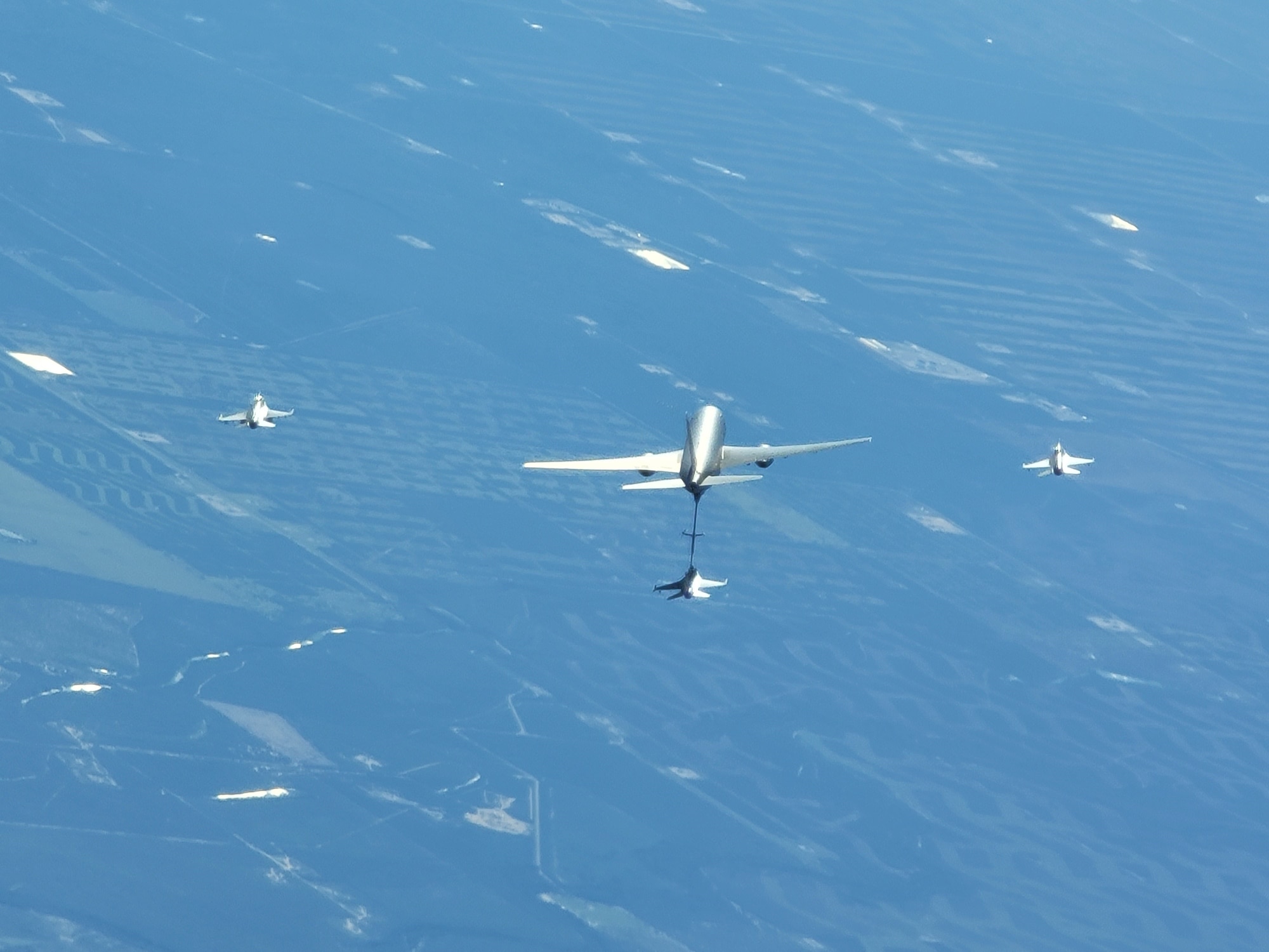 A KC-46 Pegasus from Altus Air Force Base refuels an F-16 Fighting Falcon from the Texas Air National Guard in the skies over Texas
