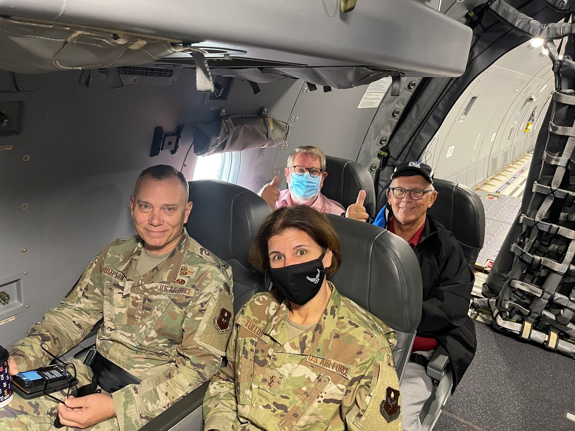 Maj. Gen. Andrea Tullos, Deputy Commander of Air Education and Training Command (AETC), and Chief Master Sgt. Erik Thompson, Command Chief Master Sergeant of AETC, sit in front of two AETC civic leaders