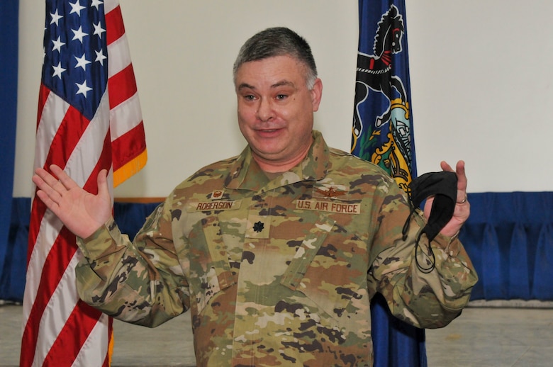 A man in uniform speaking.