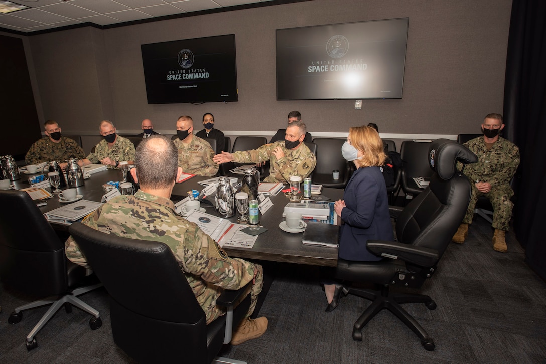 Army general and Deputy Secretary of Defense meet.