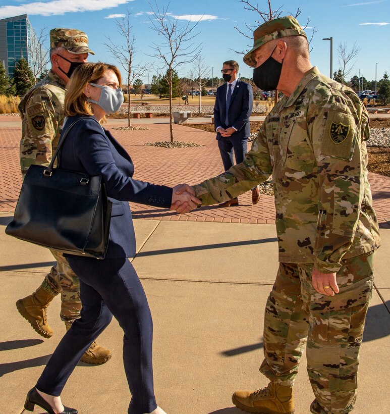 Army general and Deputy Secretary of Defense meet.