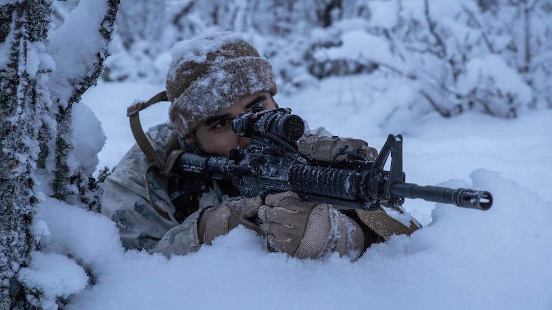 A U.S. Marine with 2nd Marine Expeditionary Force holds security during a patrol near Tolga, Norway, Dec. 5, 2021.  Marines are participating in train-the-trainer cold weather training to accurately instruct the U.S. forces arriving early in 2022 to participate in the Norwegian-led Exercise Cold Response. Exercises such as Cold Response enhances familiarity with and proficiency operating in Arctic conditions alongside Allies and partners.