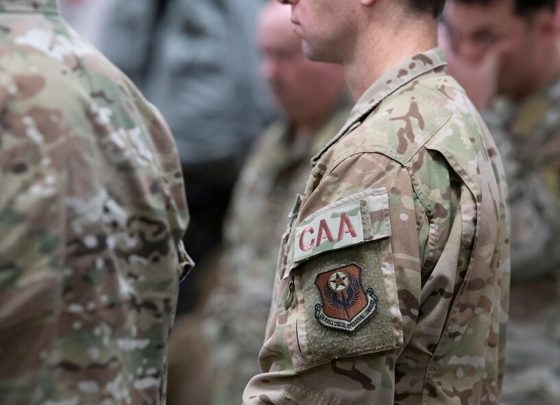 Close-up of Combat Aviation Advisor patch on Airman's shoulder in the middle of a group of Airmen.
