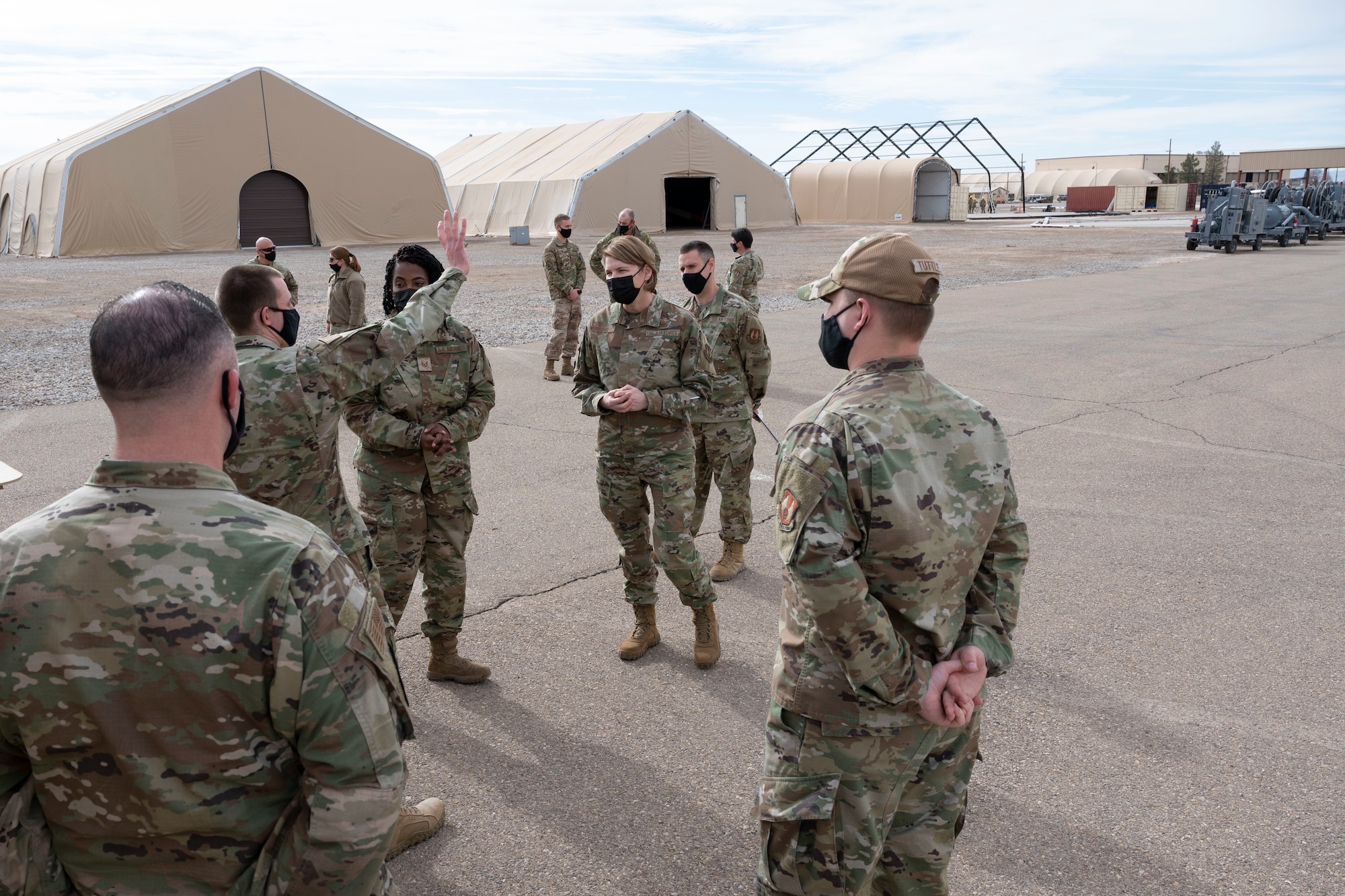 Maj. Gen. Constance McCauley von Hoffman, U.S. Air Force Materiel Command logistics director, receives an informational and hands-on brief at the Parade of Homes during a familiarization tour at the Basic Expeditionary Airfield Resources (BEAR) base, Dec. 09, 2021, on Holloman Air Force Base, N.M. von Hoffman visited BEAR base to learn more about the mission capabilities BEAR base provides to warfighters and what BEAR base has to offer in terms of mission and support needs. (U.S. Air Force photo by Airman 1st Class Antonio Salfran)