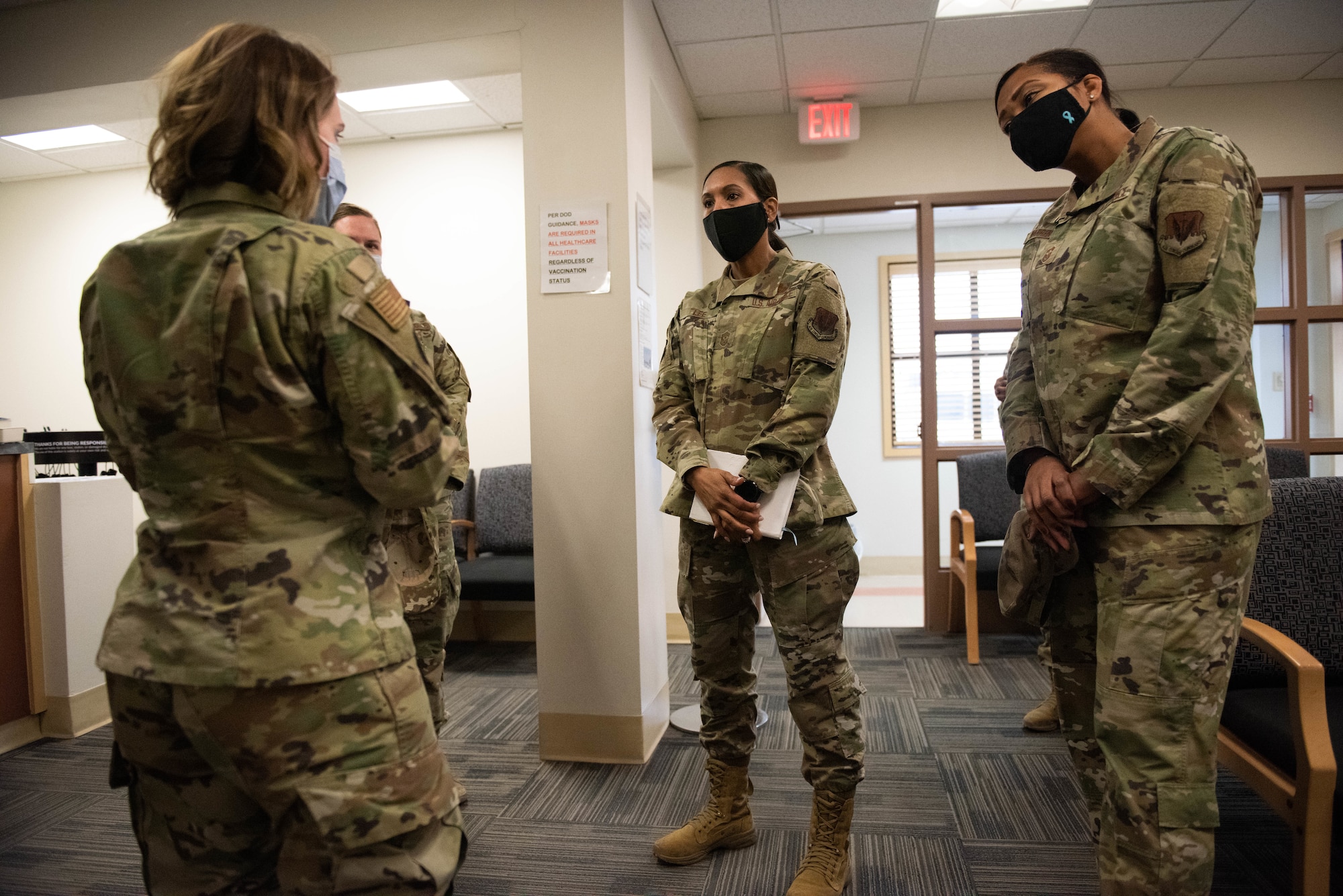 Chief Master Sgt. Sonia T. Lee, Fifteenth Air Force command chief, speaks with Airmen regarding medical care at the Hunter’s Medical Clinic.