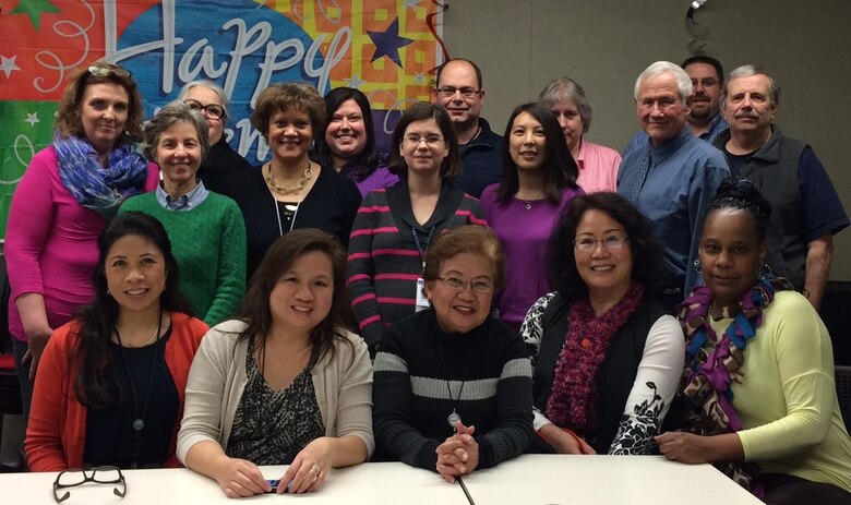 Photo of Robert Frazier with colleagues at a retirement function at the district headquarters.