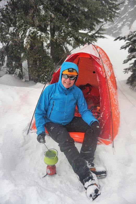 Photo of Robert Frazier camping in the snow.