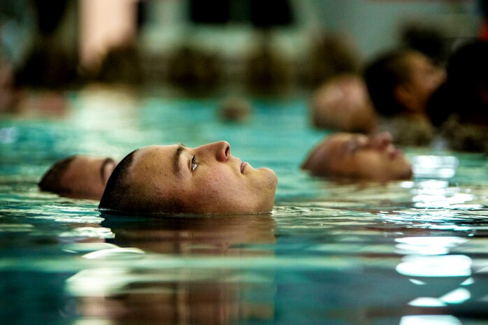 U.S. Marine Corps Recruit Ian Kornegay with Charlie Company, 1st Recruit Training Battalion, conducts basic swim qualification at Marine Corps Recruit Depot San Diego, Dec. 6, 2021.