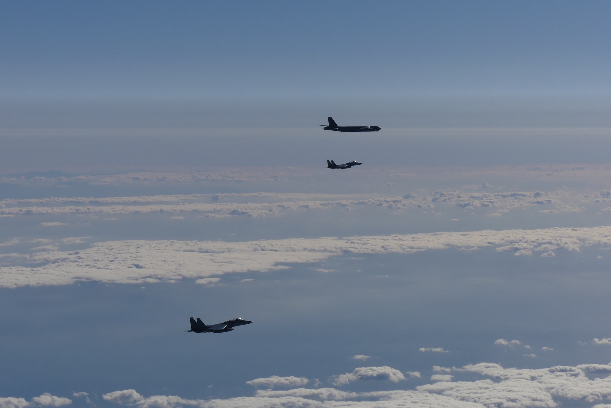 Photo of a U.S. Air Force B-52 Bomber flying with Japan Air Self-Defense Force F-2s