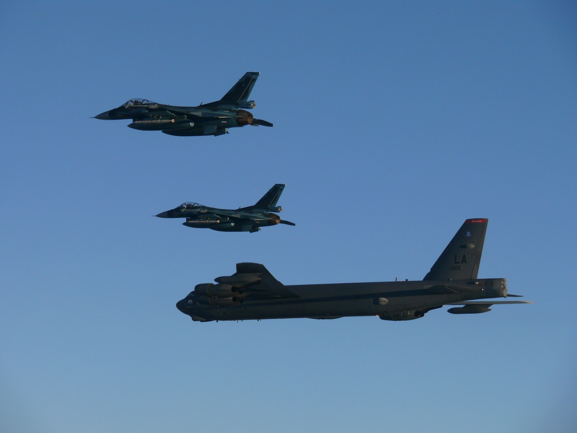 Photo of a U.S. Air Force B-52 Bomber flying with Japan Air Self-Defense Force F-2s