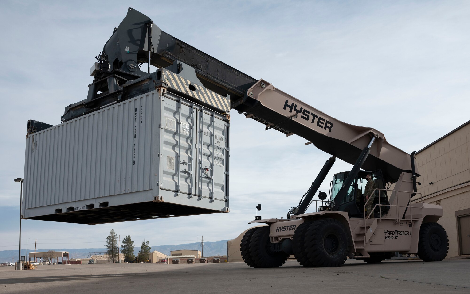 Maj. Gen. Constance McCauley von Hoffman, U.S. Air Force Materiel Command logistics director, operates a Hyster Yardmaster II Reach Stacker, Dec. 09, 2021, on Holloman Air Force Base, N.M. This was von Hoffman’s first visit to the 635th Materiel Maintenance Group’s Basic Expeditionary Airfield Resources (BEAR) base on Holloman, giving her an opportunity to familiarize herself with the machinery on the installation. (U.S. Air Force photo by Airman 1st Class Antonio Salfran)