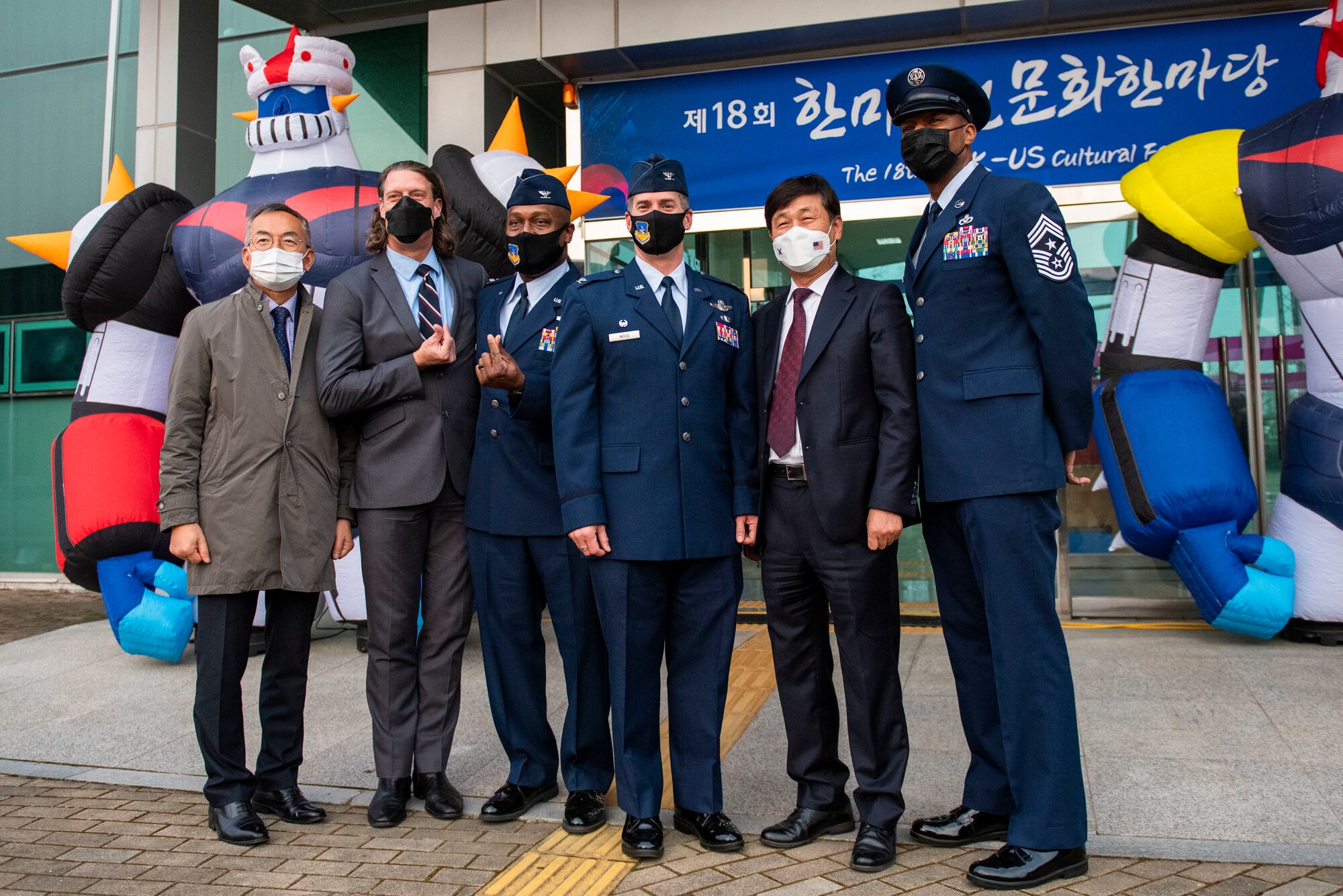 Col. Joshua Wood, 51st Fighter Wing commander, middle, Col. Henry Jeffress, 51st FW vice commander, middle left, Mr. Jang-seon Jung, Pyongtaek City mayor, middle right, and Chief Master Sgt. Alvin Dyer, 7th Air Force command chief, far right, pose for a photo