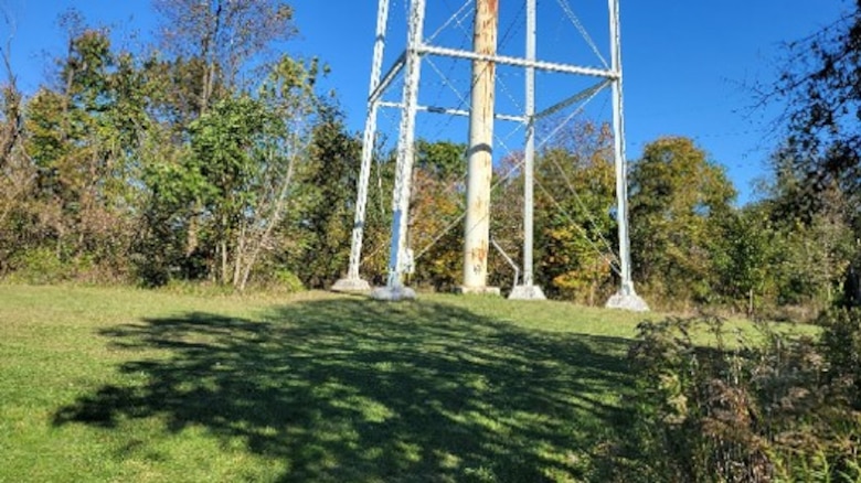 Green field and base of water tower.