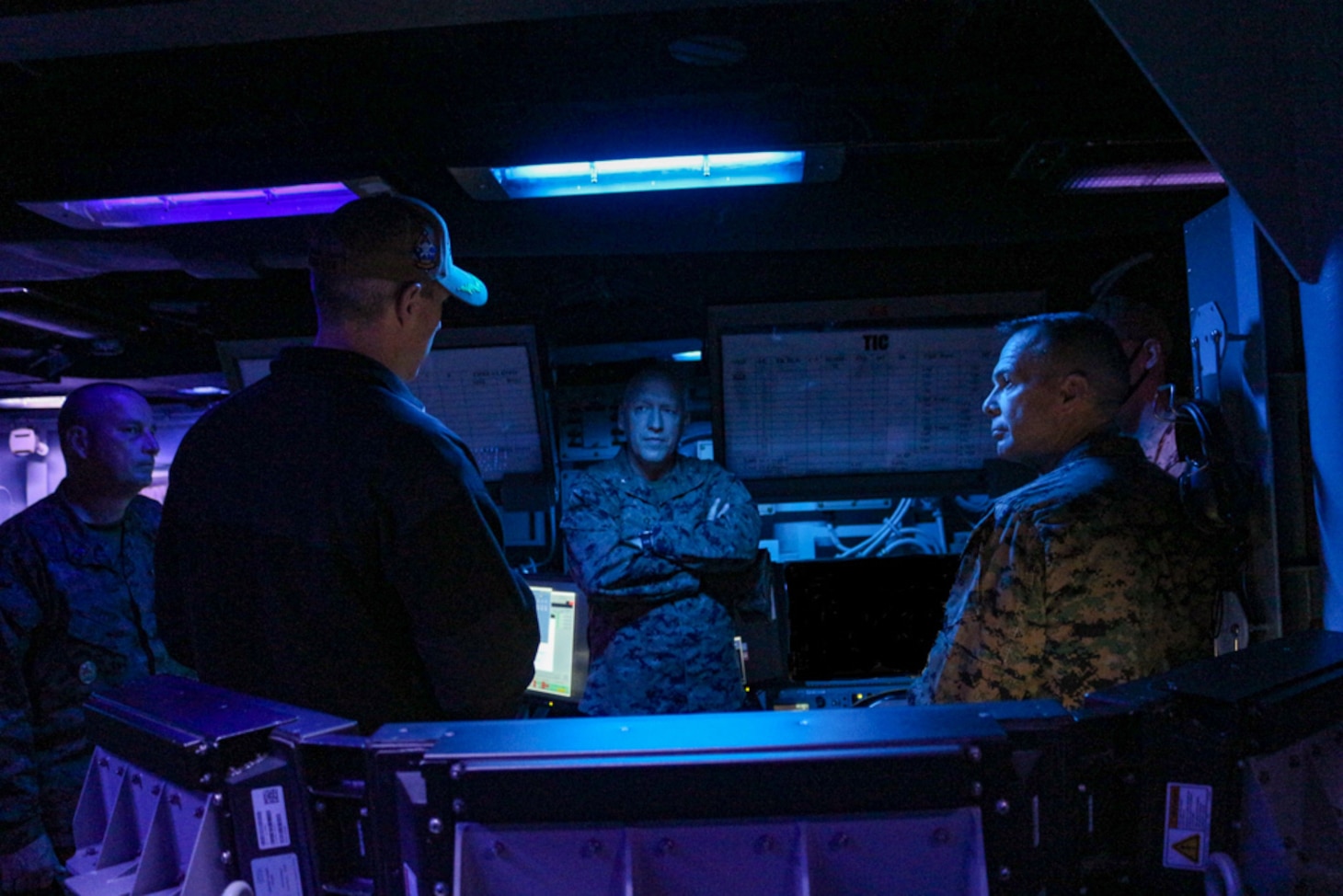 Maj. Gen. Jay Bargeron (right), commanding general, 3d Marine Division, tours the Combat Information Center of guided-missile destroyer USS Ralph Johnson (DDG 114) with the ship’s commanding officer Cmdr. Colin Roberts (left). Ralph Johnson is supporting U.S. Marines and members of the Japan Ground Self-Defense Force (JGSDF) as part of Resolute Dragon, an exercise designed to strengthen the defensive capabilities of the U.S.-Japan Alliance by refining procedures for bilateral command, control, and coordination in a geographically distributed environment.