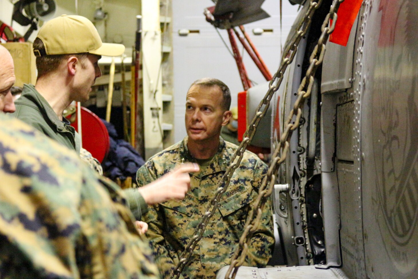 Maj. Gen. Jay Bargeron, commanding general, 3d Marine Division and Lt. Cmdr. Fleet Lawrence, Helicopter Maritime Strike Squadron (HSM) 51 are pictured with one of USS Ralph Johnson’s embarked MH-60R Helicopters. HSM-51 ‘Warlords’ Combat Element 4 contributes to the ship’s organic airborne Maritime Strike capability as it supports Resolute Dragon, an exercise designed to strengthen the defensive capabilities of the U.S.-Japan Alliance by refining procedures for bilateral command, control, and coordination in a geographically distributed environment.