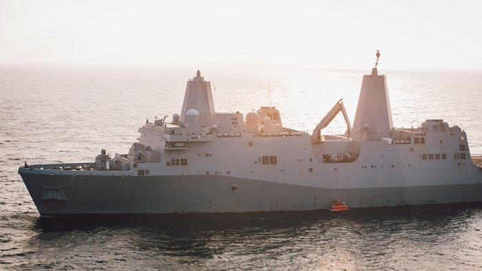 Amphibious transport dock ship USS Portland (LPD 27) lowers a static surface training target into the Gulf of Aden before conducting a high-energy laser weapon system demonstration, Dec. 14. During the demonstration, the Solid State Laser – Technology Maturation Laser Weapons System Demonstrator Mark 2 MOD 0 aboard Portland successfully engaged the training target.