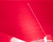 Amphibious transport dock ship USS Portland (LPD 27) conducts a high-energy laser weapon system demonstration on a static surface training target, Dec. 14, while sailing in the Gulf of Aden. During the demonstration, the Solid State Laser – Technology Maturation Laser Weapons System Demonstrator Mark 2 MOD 0 aboard Portland successfully engaged the training target.