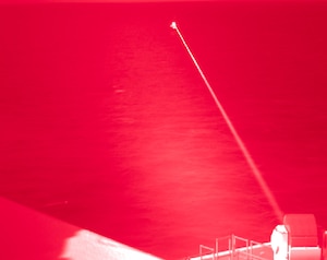 Amphibious transport dock ship USS Portland (LPD 27) conducts a high-energy laser weapon system demonstration on a static surface training target, Dec. 14, while sailing in the Gulf of Aden. During the demonstration, the Solid State Laser – Technology Maturation Laser Weapons System Demonstrator Mark 2 MOD 0 aboard Portland successfully engaged the training target.