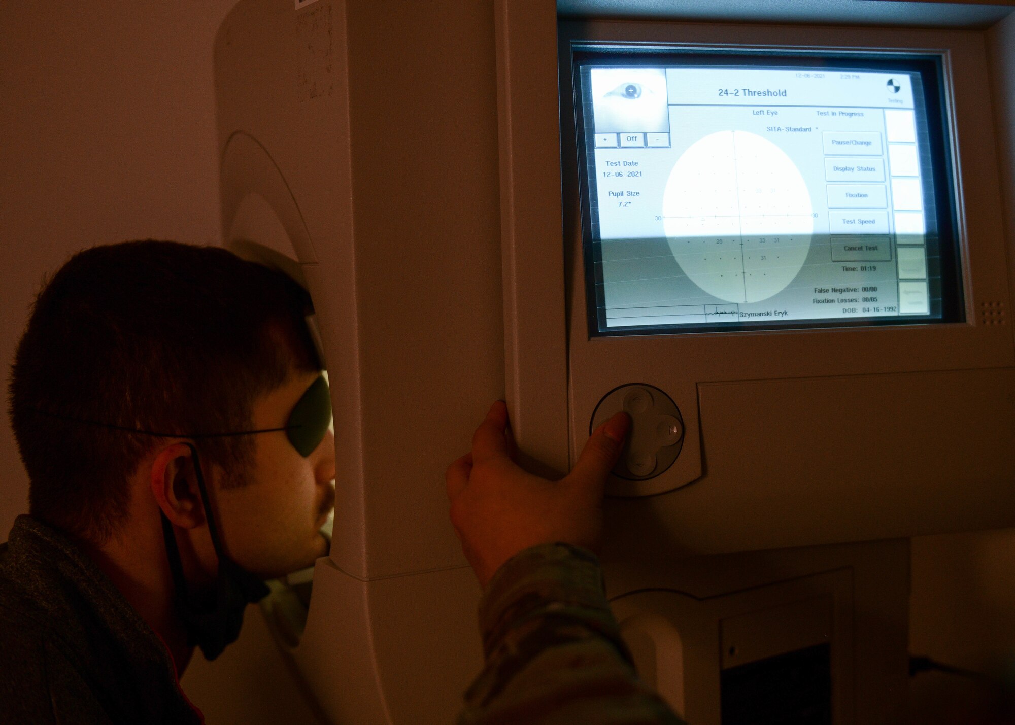 Airman 1st Class Eryk Szymanski, 31st Security Forces Squadron phase crew chief, gets his peripheral vision examined at Aviano Air Base, Italy, Dec. 6, 2021. The Humphrey visual field machine is a tool for measuring the human visual field that is commonly used by eye care professionals. (U.S. Air Force photo by Senior Airman Brooke Moeder)