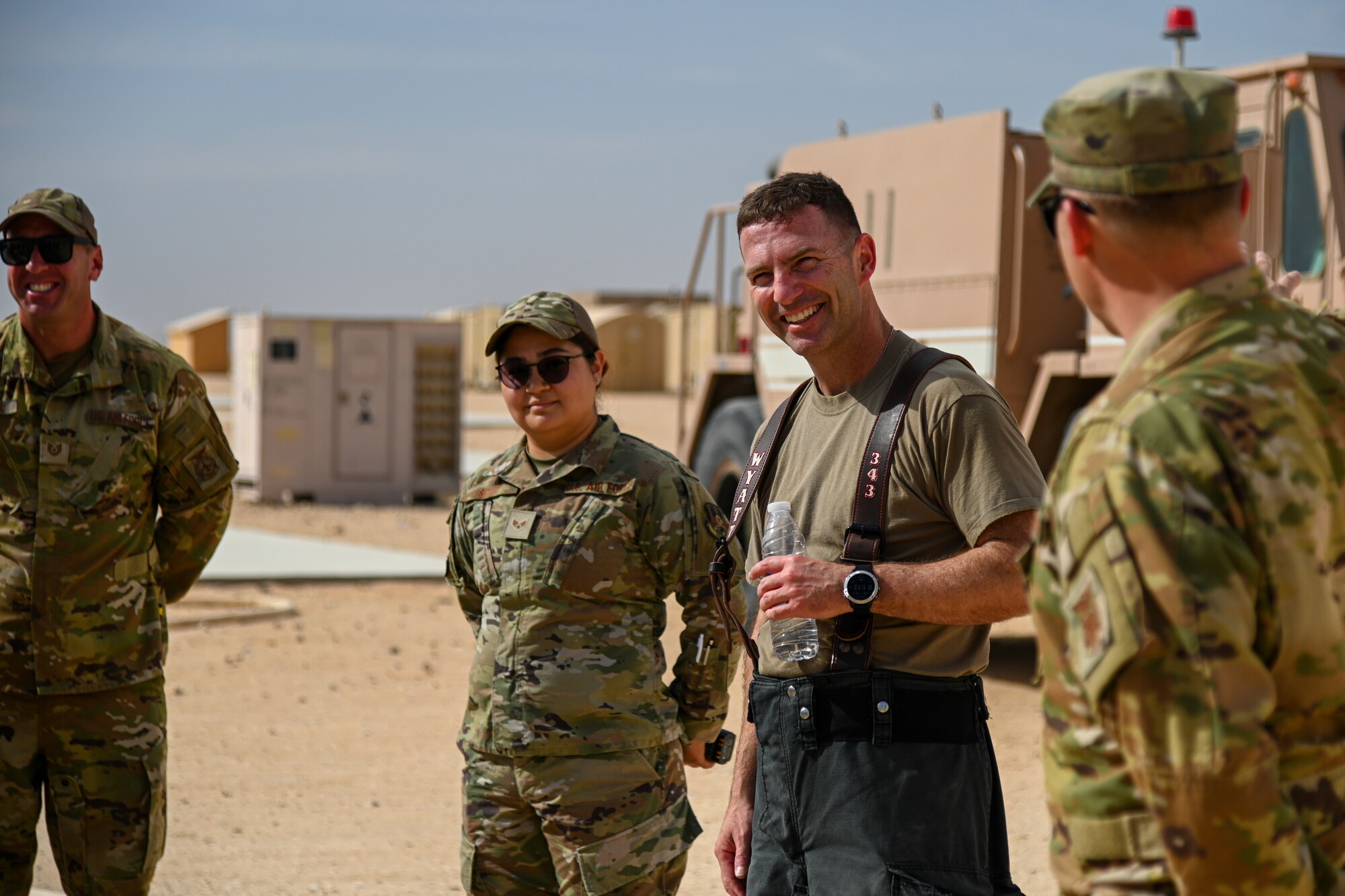 U.S. Air Force Brig. Gen. Robert Davis, 378th Air Expeditionary Wing commander, participates in a debrief alongside firefighters from the 378th Expeditionary Civil Engineer Squadron at Prince Sultan Air Base, Kingdom of Saudi Arabia, Dec. 9, 2021. Airmen from the 378th ECES regularly participate in contingency readiness development to ensure that they are always prepared to answer the call. (U.S. Air Force photo by Staff Sgt. Christina Graves)