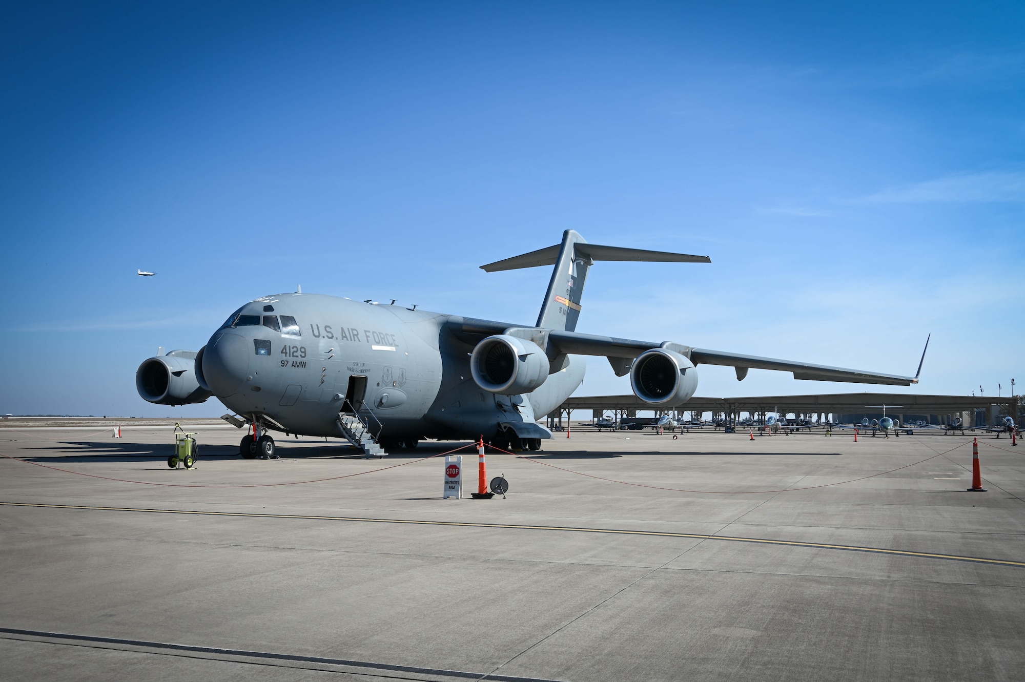 A C-17 Globemaster III from Altus Air Force Base (AFB), Oklahoma, sits on the airfield at Laughlin AFB, Texas, Dec. 10, 2021. Currently, Laughlin AFB uses the T-6 Texan II, T-38C Talon, and the T-1A Jayhawk to teach American and allied nation pilots to fly. (U.S. Air Force photo by Airman 1st Class Kayla Christenson)