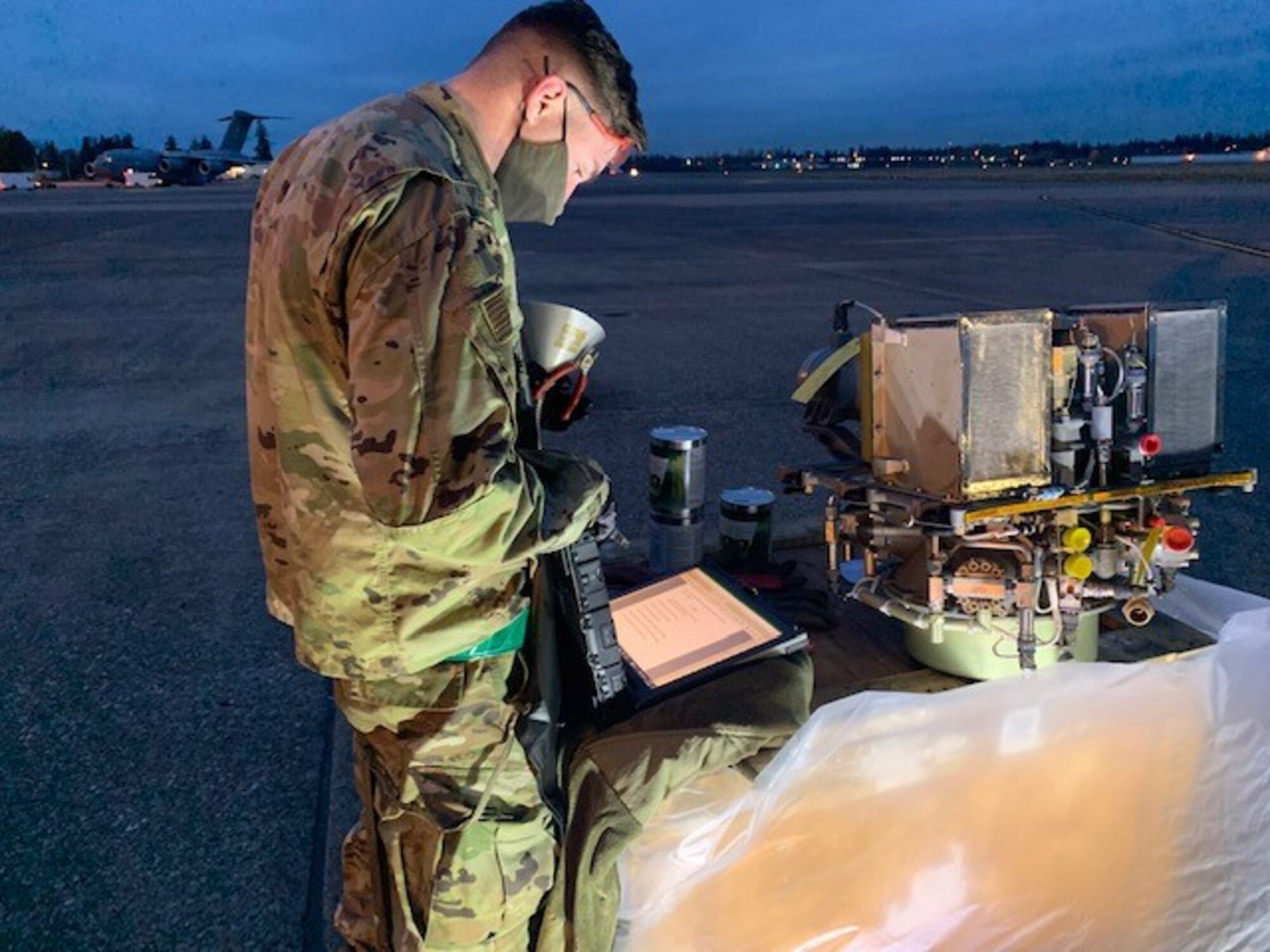 U.S. Air Force Senior Airman Stephen Garner, cross-utilization course student, prepares for on-the-job training in the Cross Utilization Course at Joint Base Lewis-McChord, Washington, Nov. 24, 2021. The CUT course is designed to train Airmen from various maintenance-related career fields and provide them the tools needed to aid undermanned or constrained Air Force Specialty Codes in order to utilize already proficiently trained Airmen to be more well-rounded, better equipped and more knowledgeable about all things related to C-17 Globemaster III maintenance. (U.S. Air Force photo by Master Sgt. Justin Bezerra)