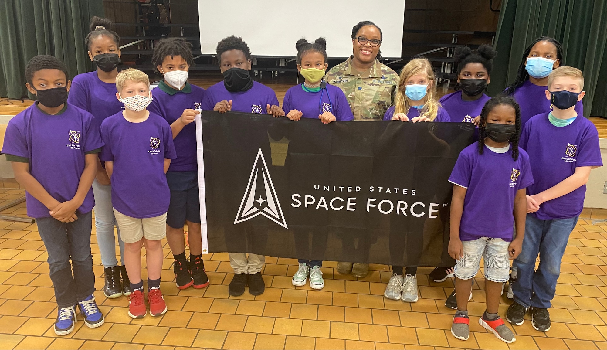 Lt. Col. Joan Thomspon, 13th Delta Operations Squadron Commander poses with students in Montgomery, Ala. following STEMtoSpace Program speaking engagement. The STEMtoSpace program’s goal is to invest in the nation’s youth, and show them the possibilities of science, technology, engineering and mathematics oriented education and the opportunities those fields present within the Space Force.