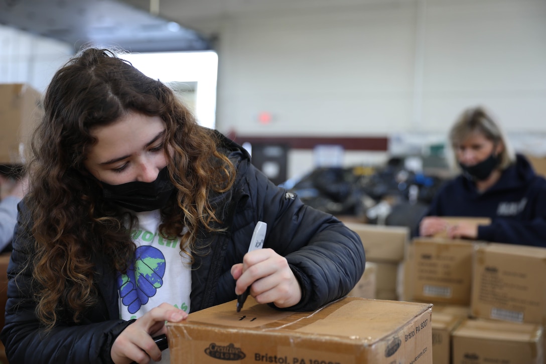 U.S. Army Reserve Officer and Students Donate School Supplies