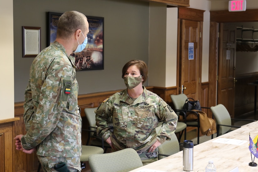U.S. Brig. Gen. Laura McHugh, Deputy Adjutant General-Army of the Pennsylvania National Guard, speaks to a Lithuanian soldier before a meeting between Pa. Guard leaders and Lithuanian dignitaries during a visit to Fort Indiantown Gap on Dec. 14, 2021. The visit was in support of the State Partnership Program and recognized the 28 year partnership between Lithuania and Pennsylvania.