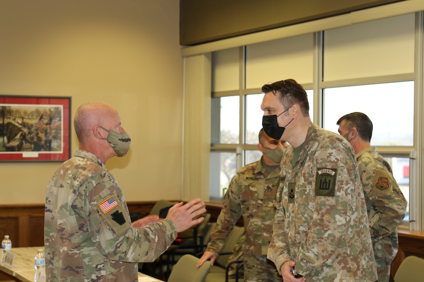 U.S. Army Maj. Gen. Mark Schindler, Adjutant General of Pennsylvania, speaks to a Lithuanian soldier before a meeting between Pa. Guard leadership and Lithuanian dignitaries during a visit to Fort Indiantown Gap on Dec. 14. The visit was in support of the State Partnership Program and recognized the 28 year partnership between Lithuania and Pennsylvania.