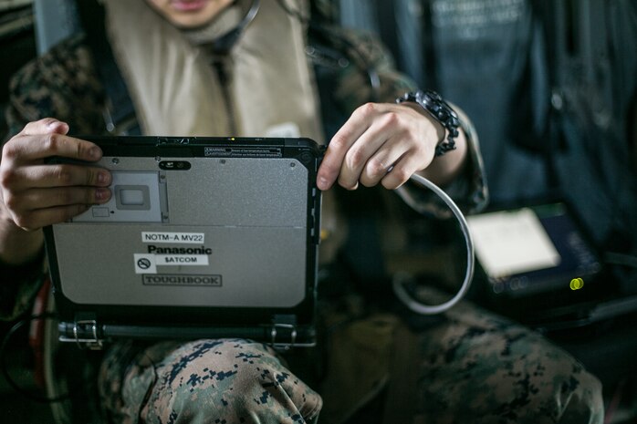Lance Cpl. Anfernee G. Amaya, a network administrator with Marine Air Control Group 18 Detachment, 31st Marine Expeditionary Unit, and a native of El Paso, Texas, tests the connectivity of the Networking On-the-Move Airborne communications system during flight operations from the amphibious assault ship, USS America (LHA 6). The NOTM-A provides the mission commander the ability to command and control forces on the ground while flying above the battlefield. America, flagship of the America Expeditionary Strike Group 7, along with the 31st MEU, is operating in the 7th fleet area of operations to enhance interoperability with allies and partners and serve as a ready response force to defend peace and stability in the Indo-Pacific region.