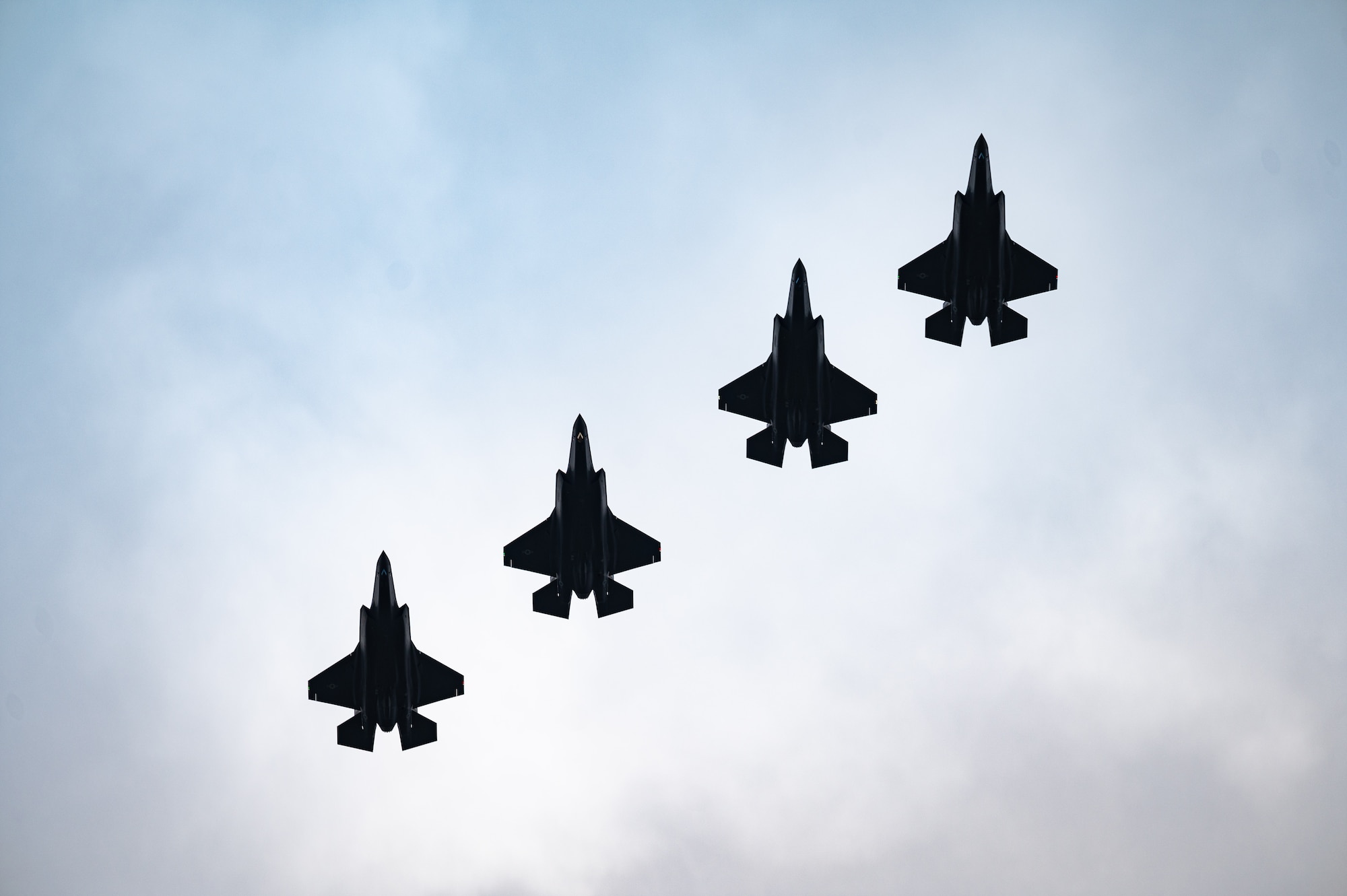 U.S. Air Force F-35A Lightning II’s assigned to the 495th Fighter Squadron conduct a flyover upon arrival at Royal Air Force Lakenheath, Dec. 15, 2021. The F-35A is an agile, versatile, high-performance, 9-g capable multirole fighter that combines stealth, sensor fusion, with unprecedented situational awareness. (U.S. Air Force photo by Senior Airman Koby I. Saunders)