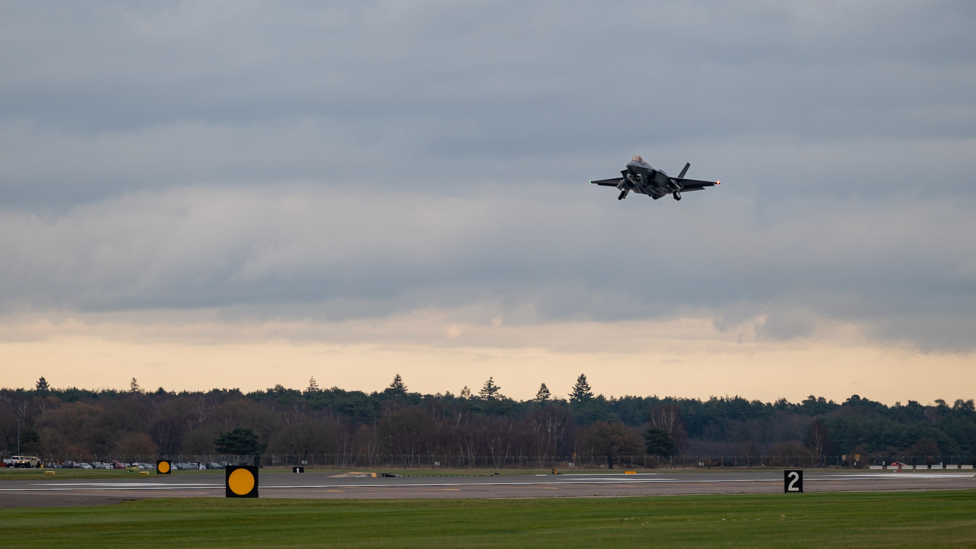 A U.S. Air Force F-35A Lightning II assigned to the 495th Fighter Squadron lowers landing gear upon arrival at Royal Air Force Lakenheath, Dec. 15, 2021. The arrival of the 5th-generation aircraft at the Liberty Wing has been planned since 2015, marking its placement within the United Kingdom a critical component for training and combat readiness due to airspace and F-35 program partnership.(U.S. Air Force photo by Senior Airman Koby I. Saunders)