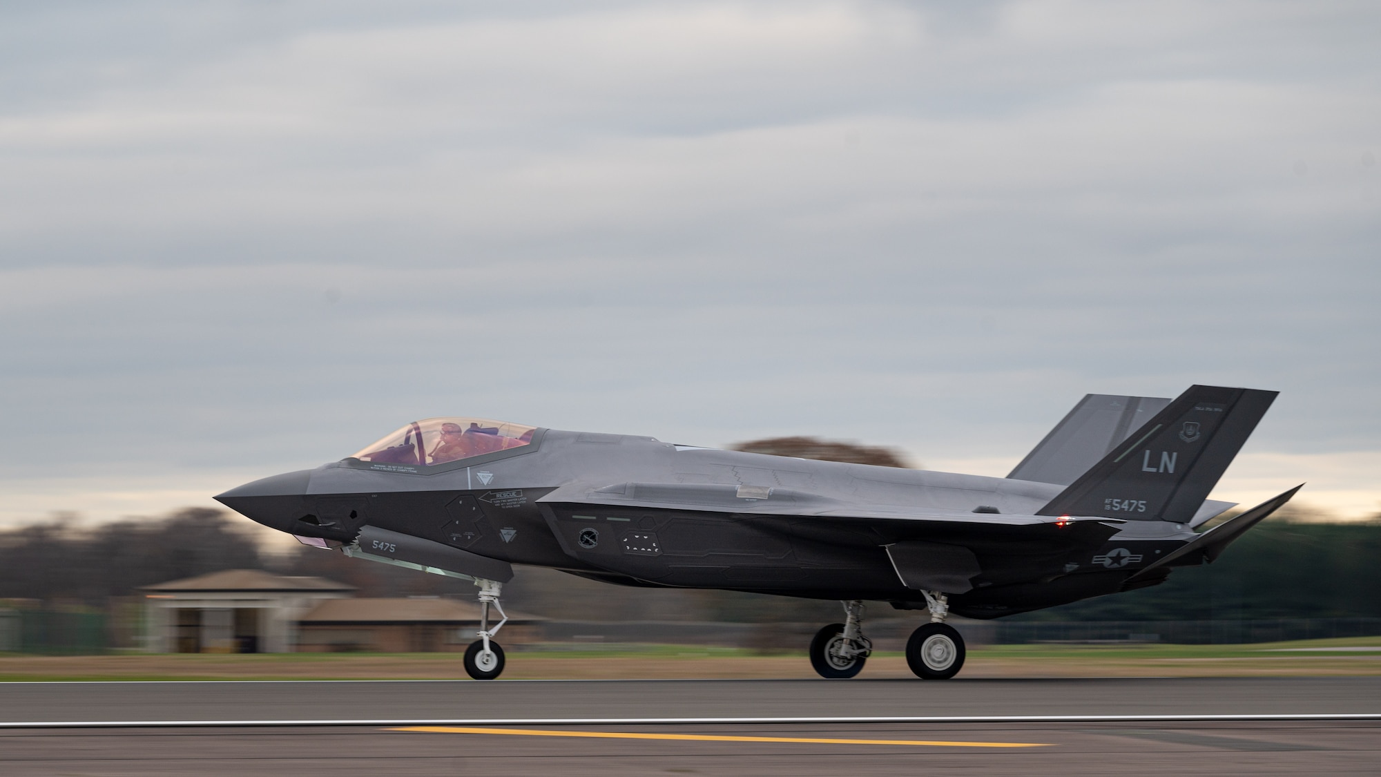 A U.S. Air Force F-35A Lightning II assigned to the 495th Fighter Squadron lands on the flightline at Royal Air Force Lakenheath, Dec. 15, 2021. The Liberty Wing was selected to host the first F-35 squadrons in Europe based on numerous factors, to include existing infrastructure, history with supporting fighter operations and the combined training opportunities the UK has to offer. (U.S. Air Force photo by Senior Airman Koby I. Saunders)